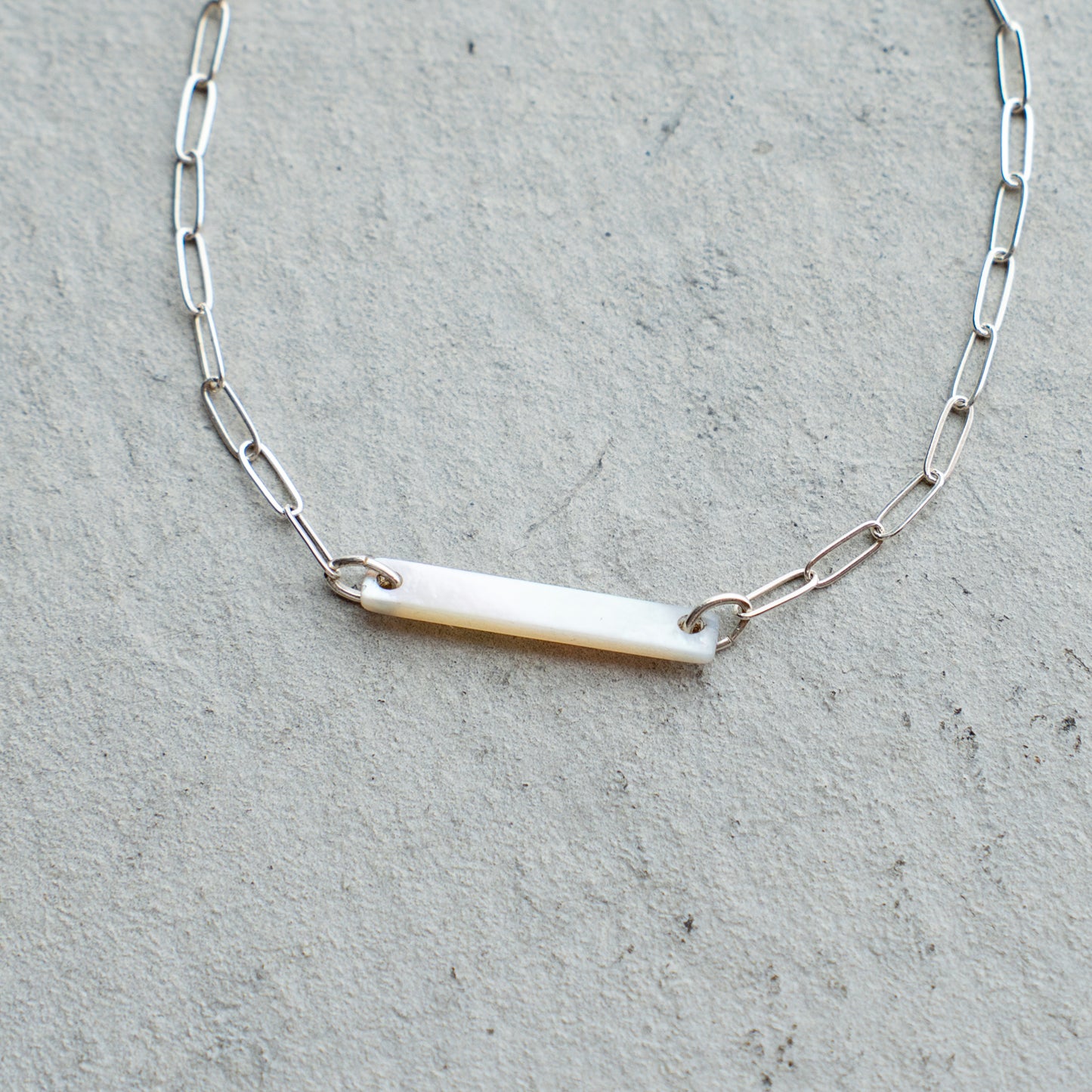 Melanie DeCourcey  Silver chain with long white mother of pearl square