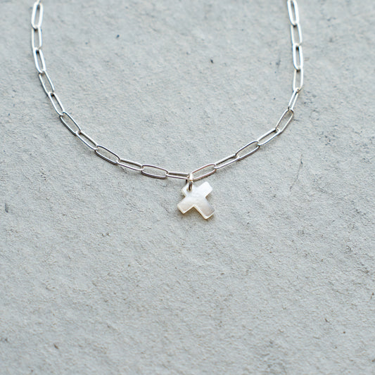 Melanie DeCourcey  Silver chain with small white mother of pearl cross