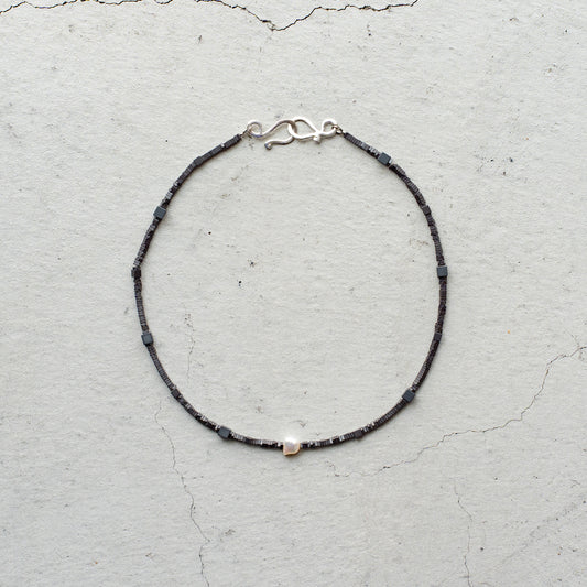 Melanie DeCourcey   Different shape Hematite with pearl center