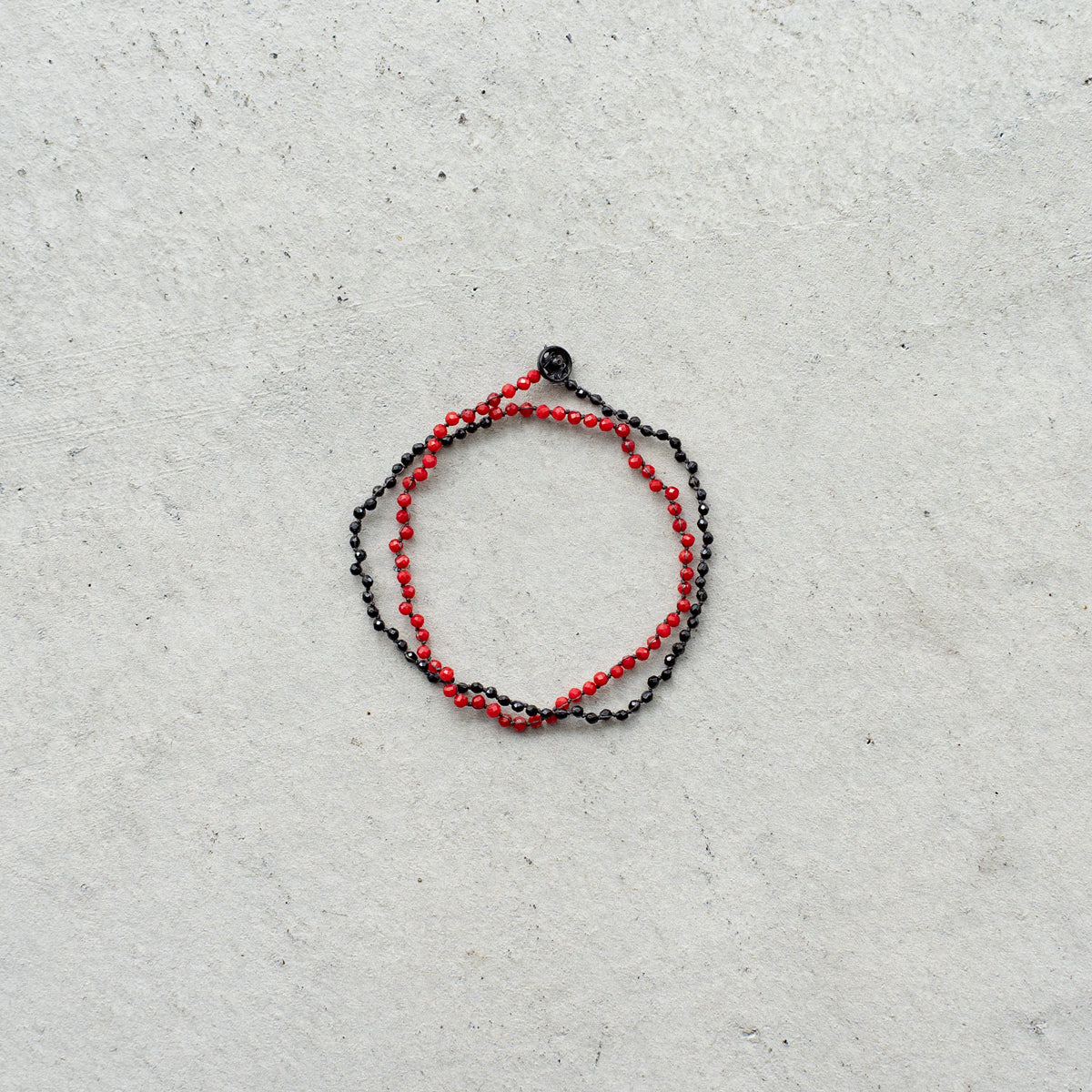 Melanie DeCourcey   Dyed coral and black tourmaline DNA double bracelet