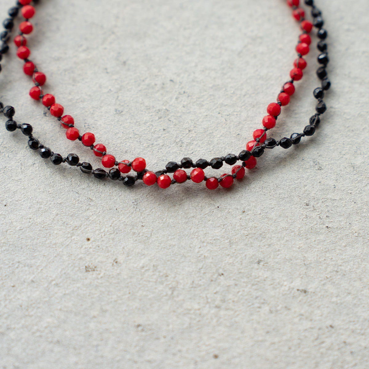Melanie DeCourcey   Dyed coral and black tourmaline DNA double bracelet