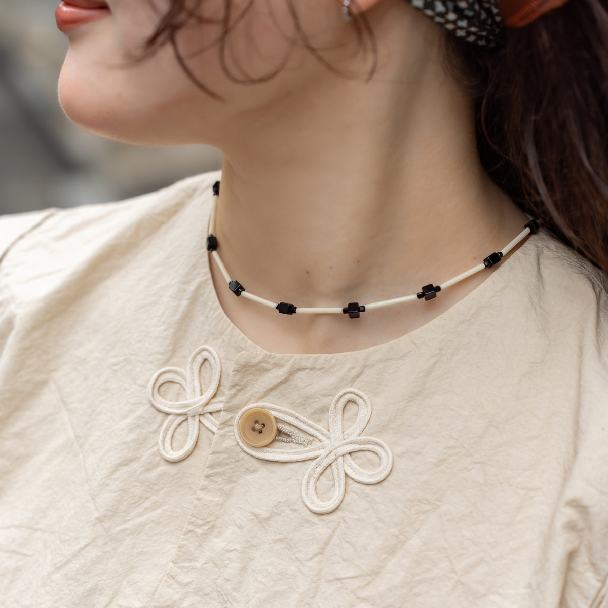 Melanie Decourcey  Ivory color glass tubes alternating with onyx cube