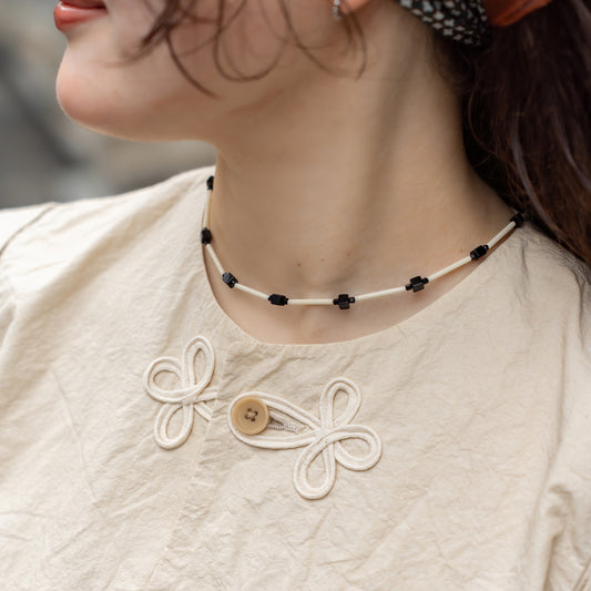 Melanie Decourcey  Ivory color glass tubes alternating with onyx cube