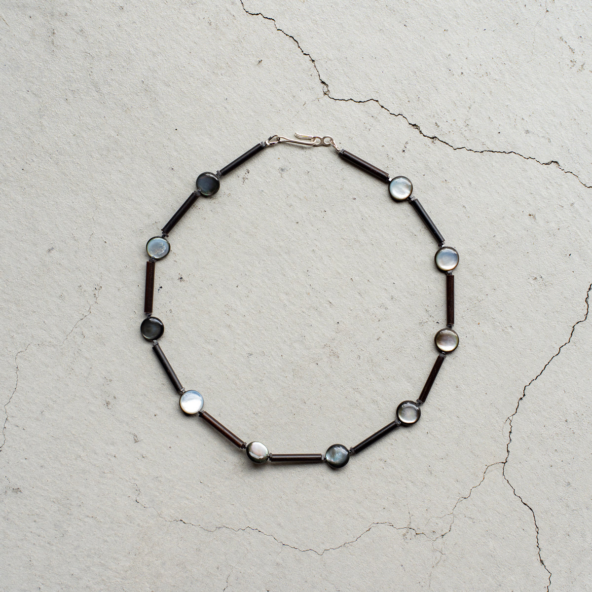 Melanie DeCourcey   Wood, small hematite and black mother of pearl