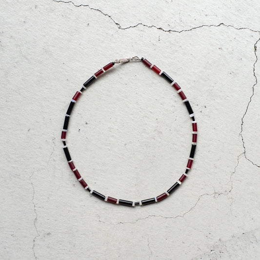 Melanie DeCourcey   Red African glass beads, onyx, moonstone