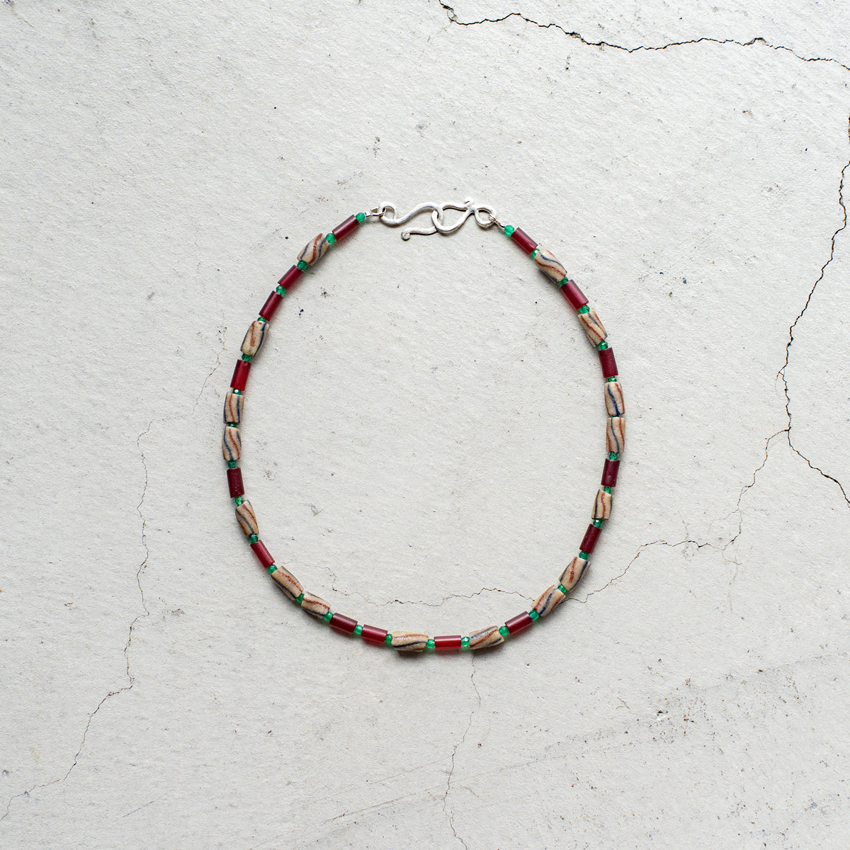 Melanie DeCourcey   Different African glass beads alternating with green agate