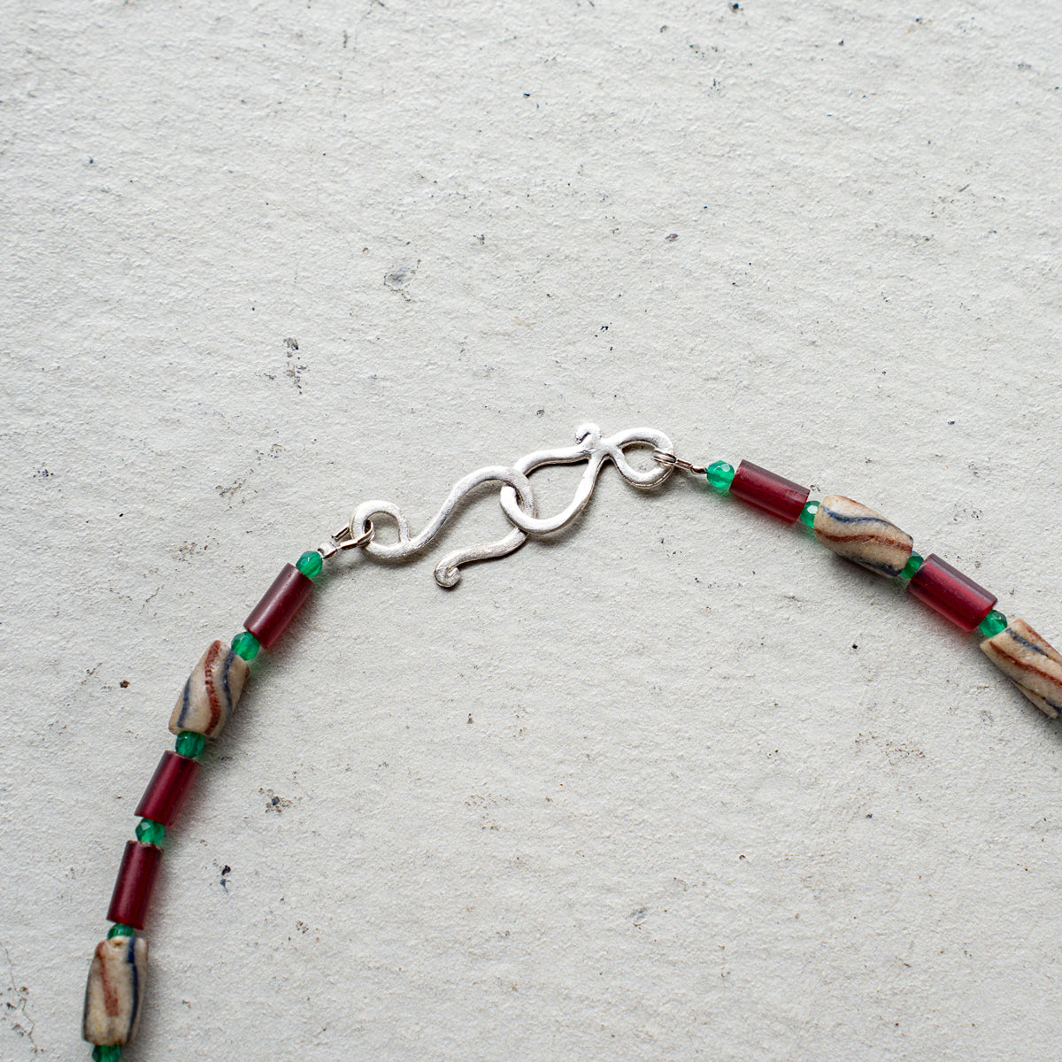 Melanie DeCourcey   Different African glass beads alternating with green agate