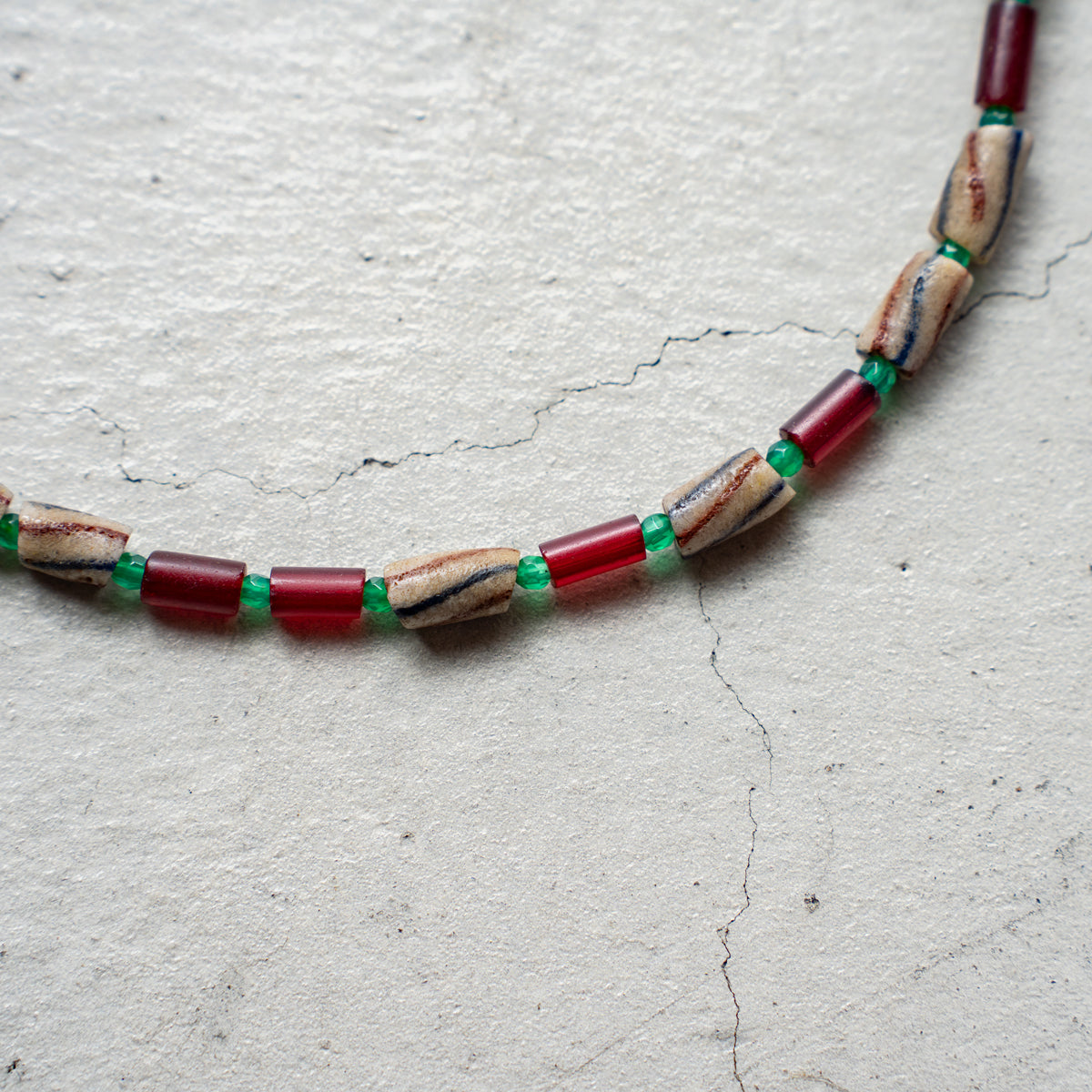 Melanie DeCourcey   Different African glass beads alternating with green agate