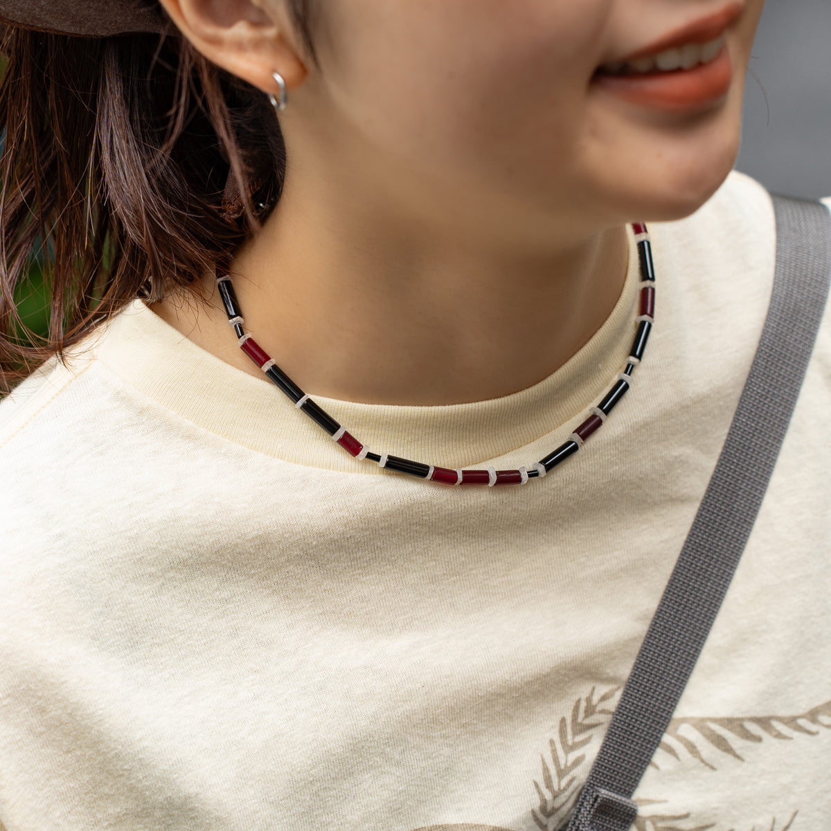 Melanie DeCourcey   Red African glass beads, onyx, moonstone