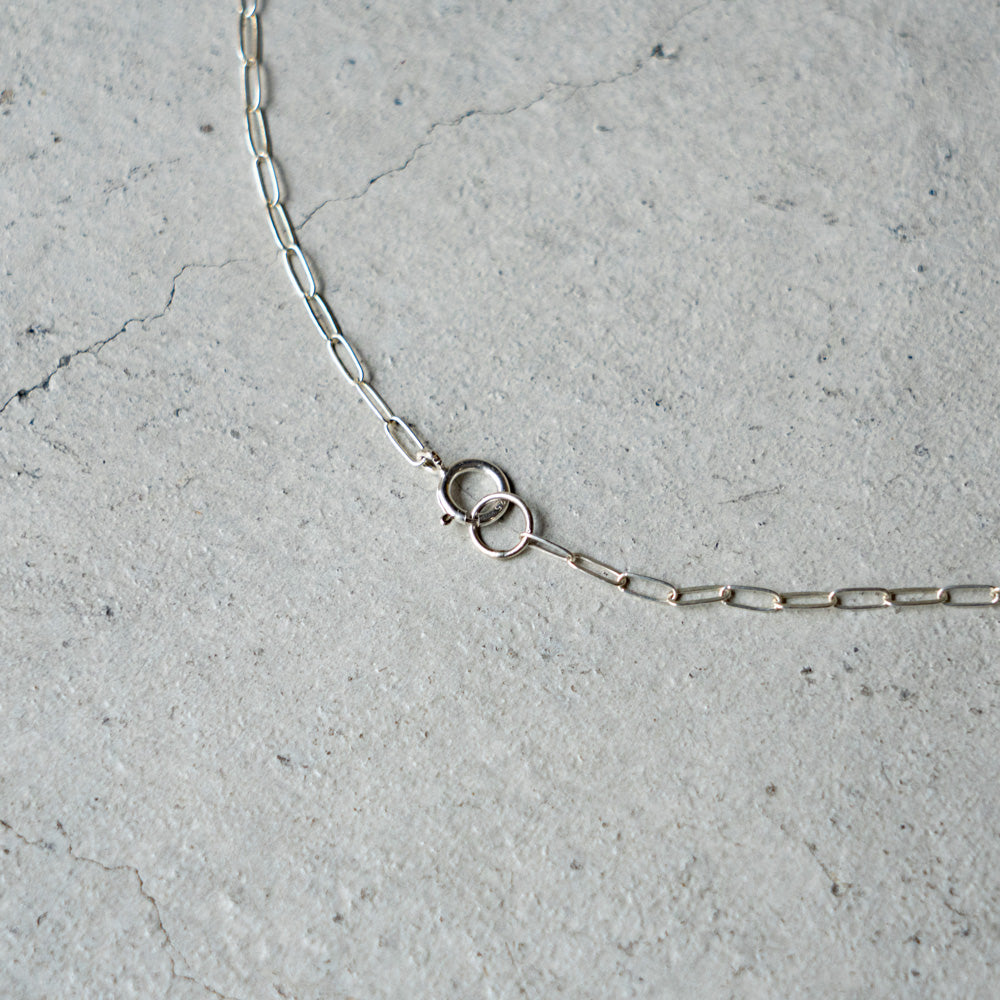 Melanie DeCourcey   Silver cube on chain